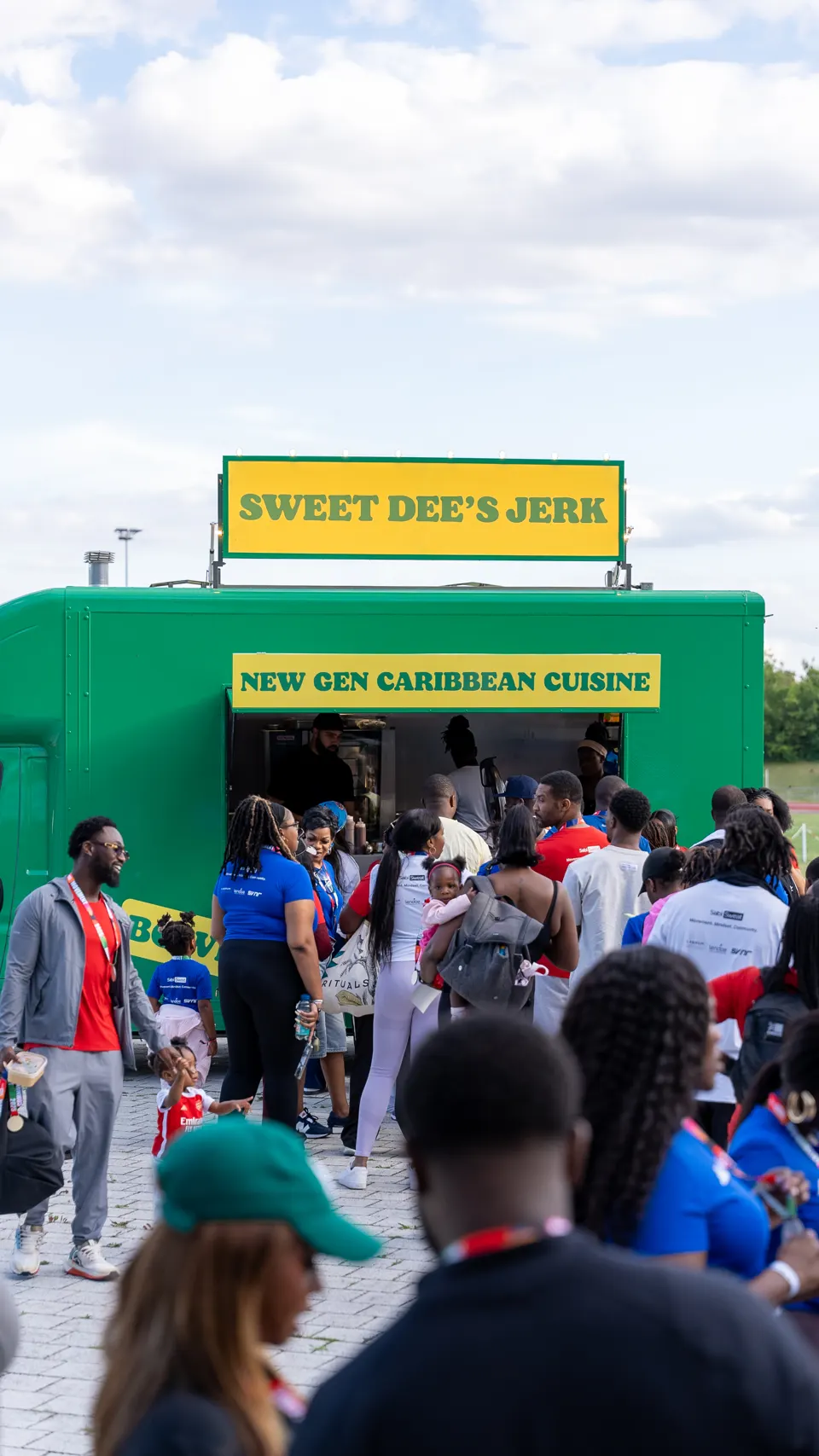 The crowd queuing at Sweet Dee's Jerk food truck after the games
