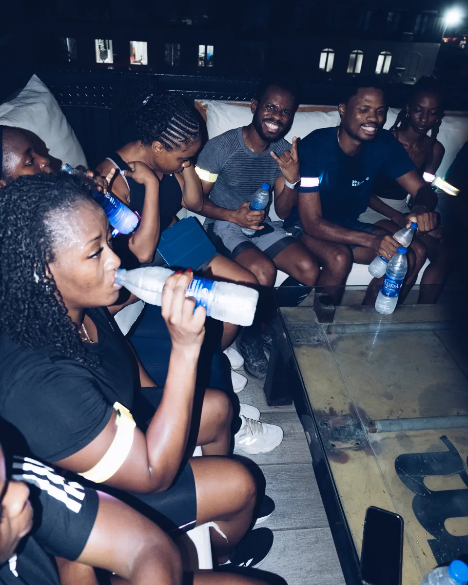 Members catching their breath and hydrating after a Lagos night run